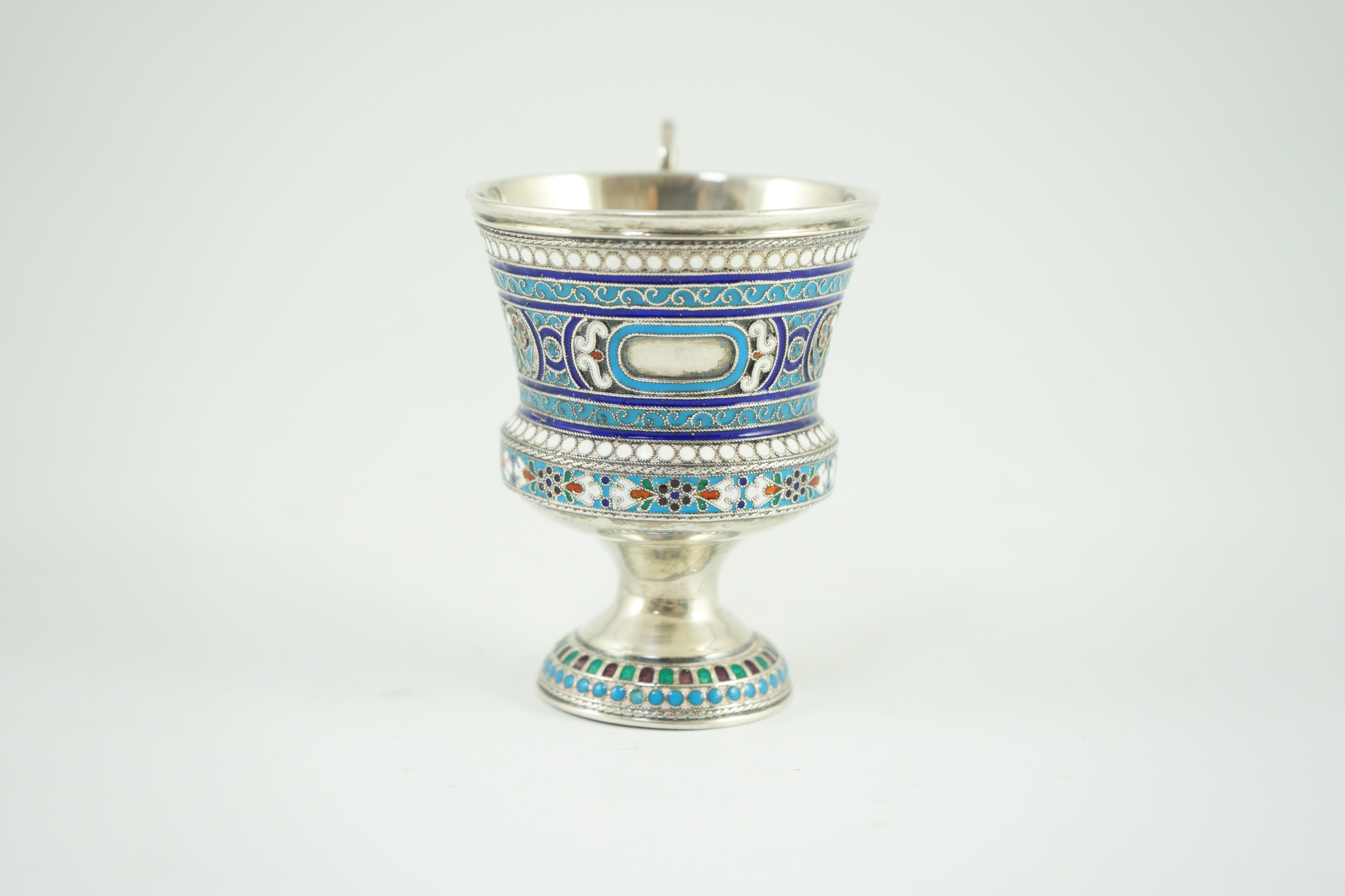 An early 20th century Russian 84 zolotnik and polychrome cloisonné enamel pedestal mug